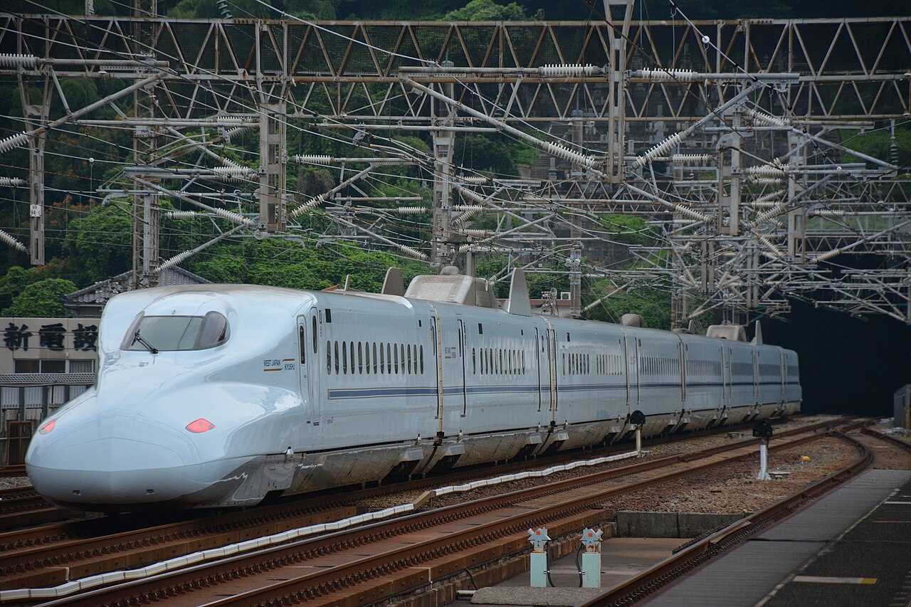 A JR West N700-7000 series set S1 passing Shin-Shimonoseki Station on a Sakura service on the Sanyo Shinkansen.